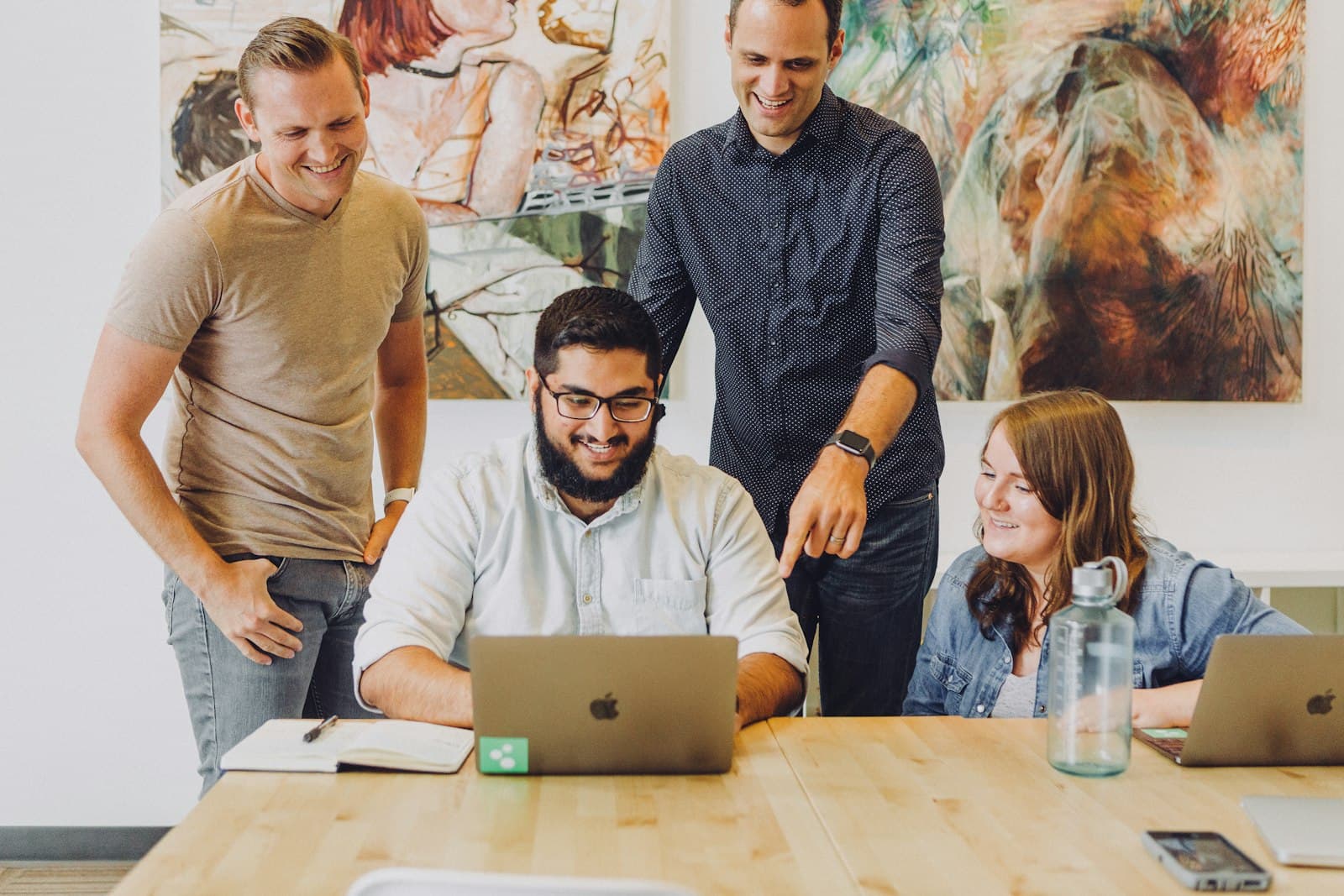 bulk SMS database India — Sales team reviewing decision-maker contacts on a laptop