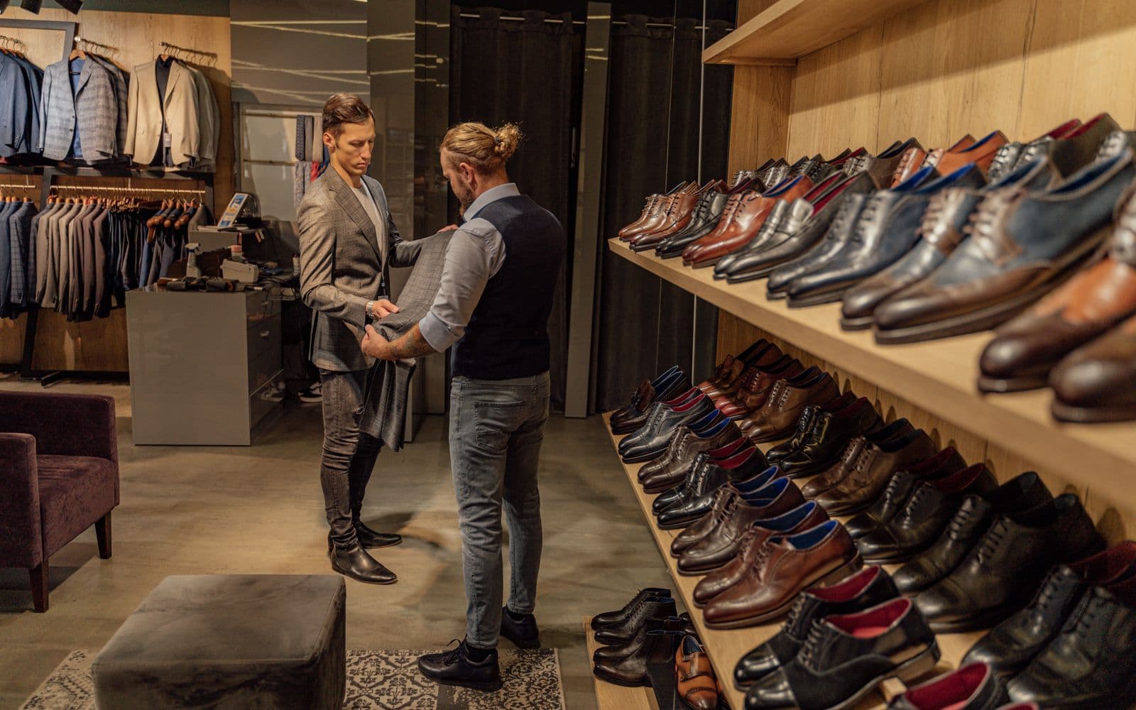 Two men browsing menswear in a clothing boutique